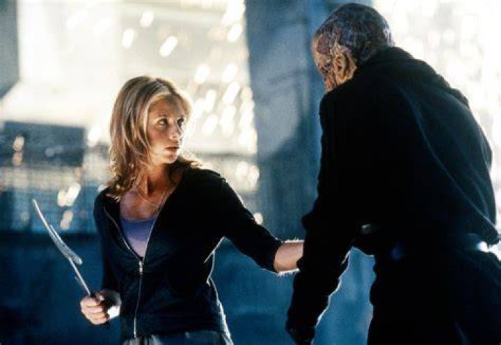 Buffy (dressed as Little Red Riding Hood), Xander (in James Bond cosplay) and Willow (as Joan of Arc) look on in fear in 'Buffy the Vampire Slayer' episode Fear Itself.