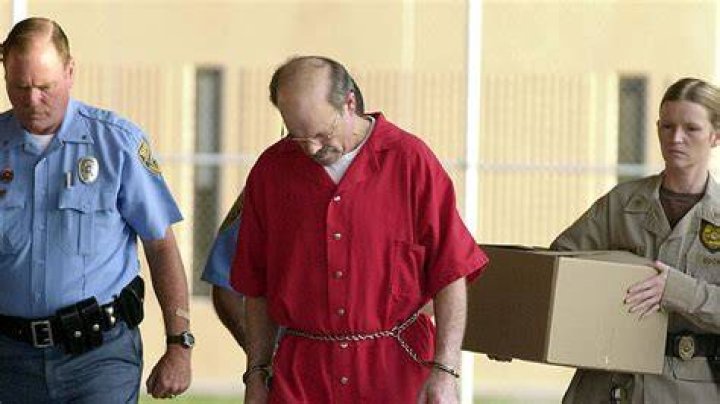 Dennis L. Rader (L), the man admitting to be the BTK serial killer, is escorted into the El Dorado Correctional Facility on August 19, 2005 in El Dorado, Kansas. Dennis Rader of Park City, Kansas pleaded guilty to the 10 killings dating back to 1974. Rader received 10 life terms and a "hard 40" for the ten murders he committed over nearly 30 years.