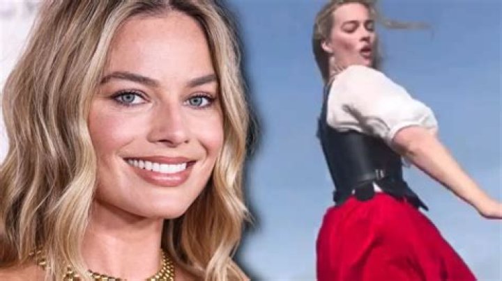 Margot Robbie dances in a red dress in Babylon.
